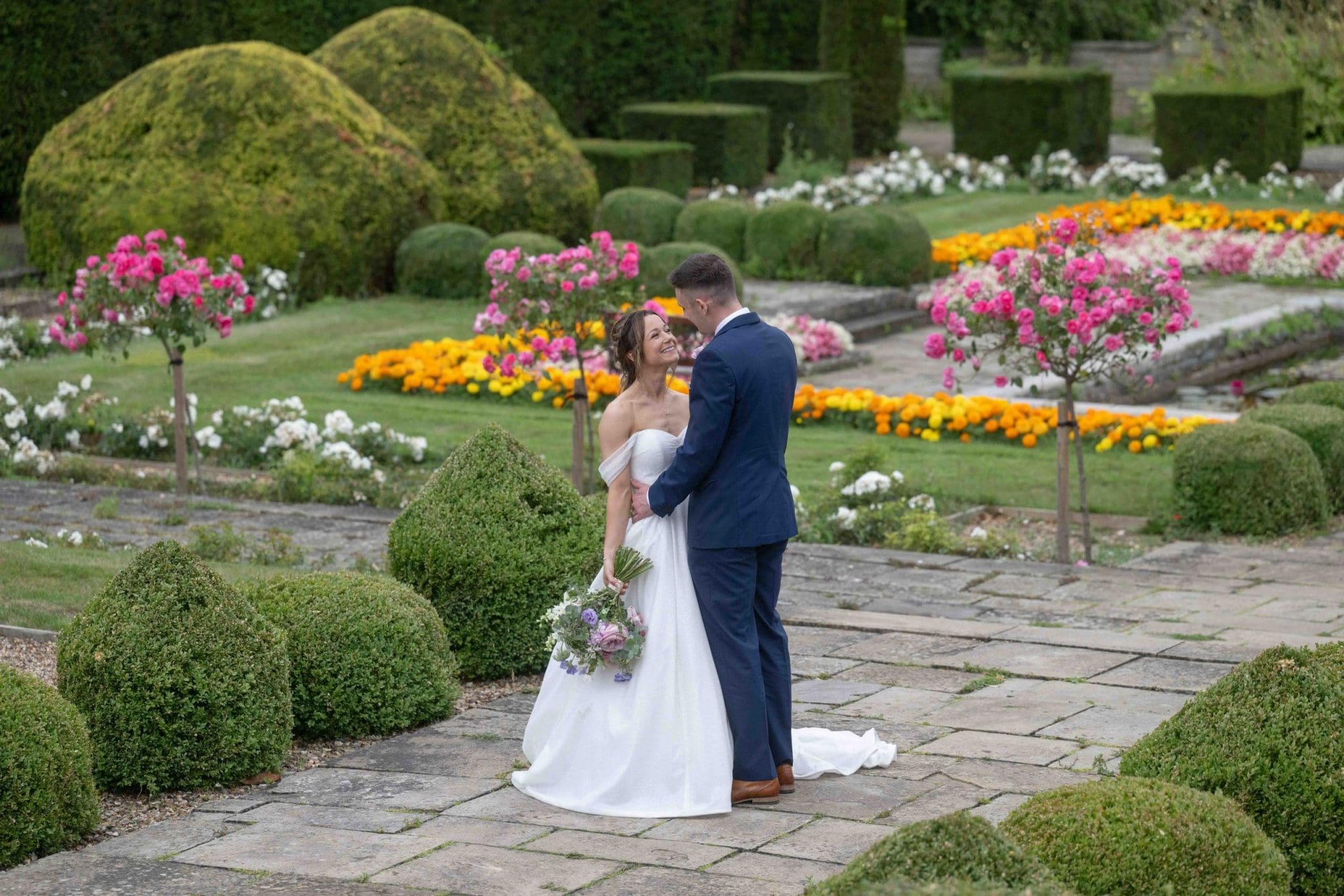 Bride and Groom in the garden at Fanhams Hall