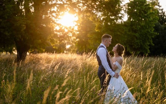 Sunset shot of bride and groom at Fanhams Hall